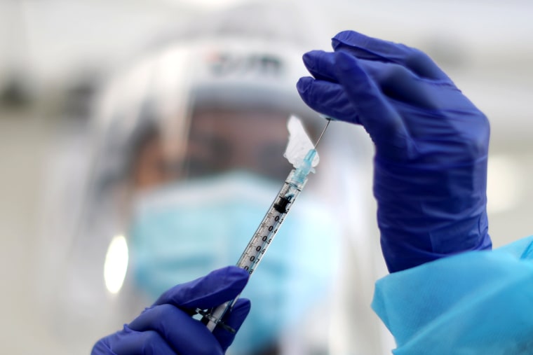 Image: A healthcare worker prepares a Pfizer coronavirus disease (COVID-19) vaccination in Los Angeles