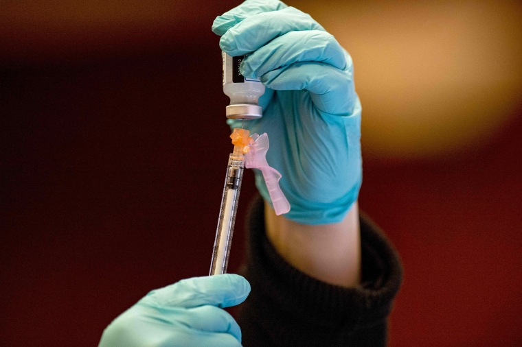 Image: A nurse draws the Moderna vaccine