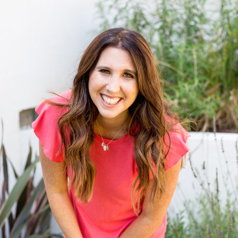 Headshot of woman wearing pink shirt