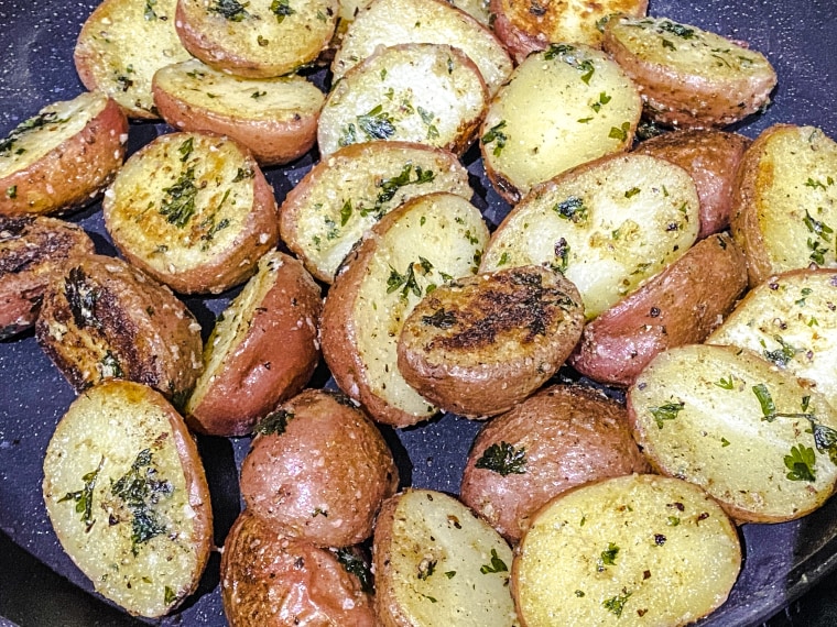A side dish of simple red potatoes, parboiled and sautéed in butter, was the perfect complement to our steaks.