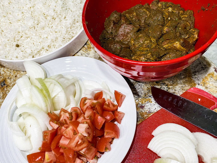 Marinated lamb, tomatoes and onion, all ready to become part of our biryani.