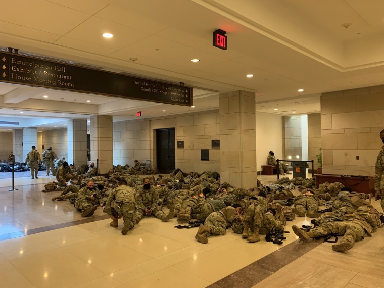 Members of National Guard sleep at Capitol Visitor Center