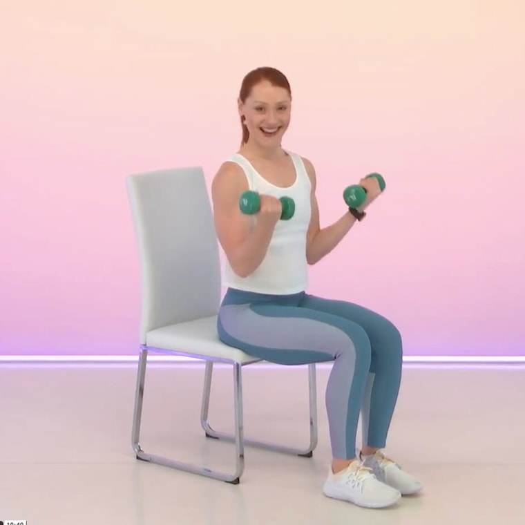 Obe fitness instructor sitting down with weights