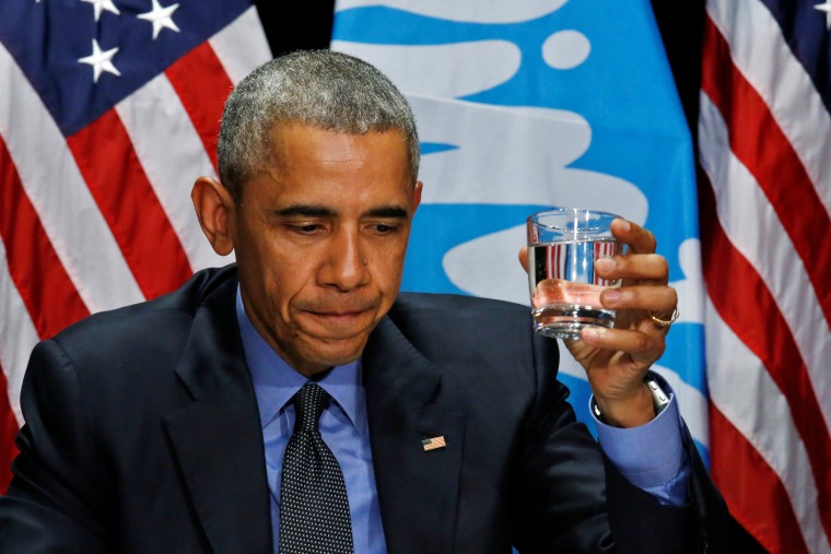 Image: U.S. President Barack Obama drinks a glass of filtered water from Flint, a city struggling with the effects of lead-poisoned drinking water, during a meeting will local and federal authorities in Michigan