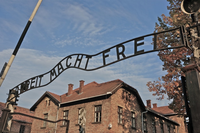 Image: The entrance to the Auschwitz I German Nazi concentration and extermination camp, with the motto 'Arbeit macht frei' ('Work brings freedom') over the gateway, southern Poland.
