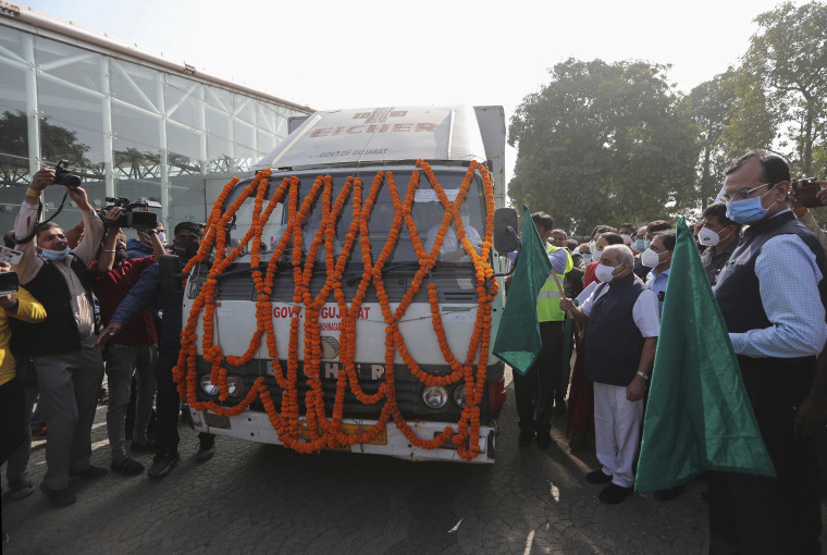 Image: A vehicle carrying the coronavirus vaccine and decorated with marigold flower garlands at the Ahmedabad, India airport on Tuesday.