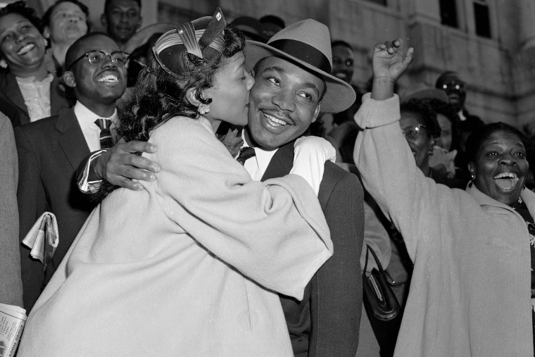 Martin Luther King Jr. is welcomed with a kiss from his wife, Coretta Scott King, after leaving court in Montgomery, Ala., on March 22, 1956.