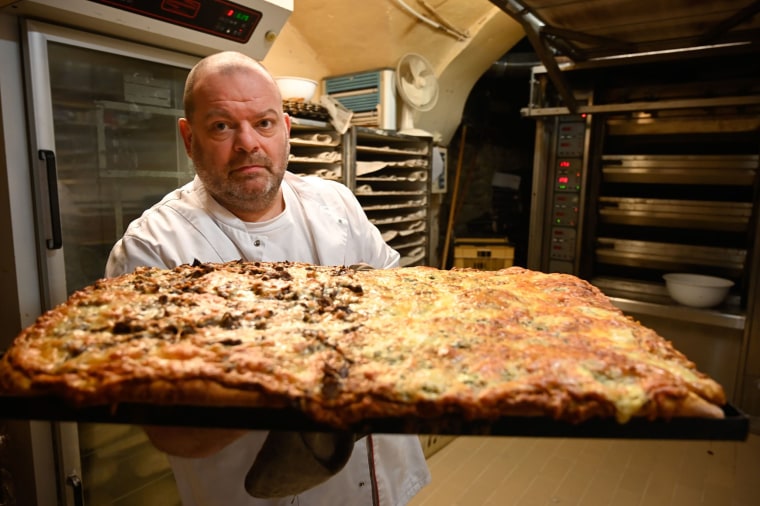 Image: French baker Stephane Ravacley poses in his bakery in Besancon, eastern France