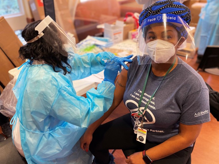 Sonya Williams, recreational therapist and activities director at A.G. Rhodes Cobb, receives the Covid-19 vaccine in December.