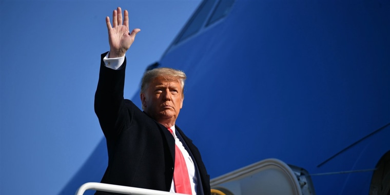 President Donald Trump waves as he boards Air Force One at Andrews Air Force Base in Maryland on Jan. 12, 2021.