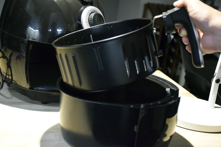 Yes, you should be cleaning the basket and drawer after cooking in them.