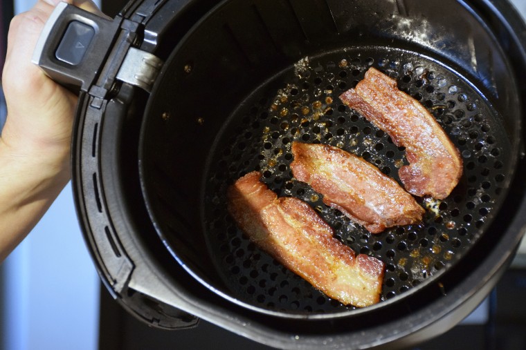 Cooking bacon in your air fryer reduces the amount of grease you consume.