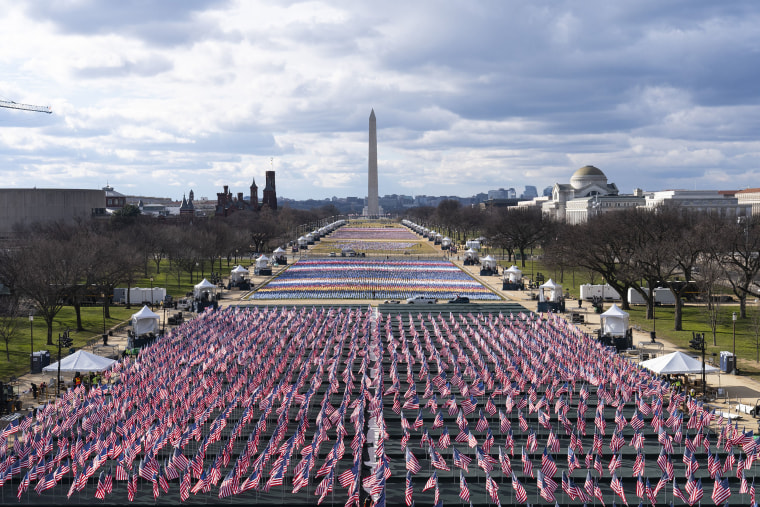 Image: Flags are placed on the National Mall, looking towards the Washington Monument, and the Lincoln Memorial, ahead of the inauguration of President-elect Joe Biden and Vice President-elect Kamala Harris