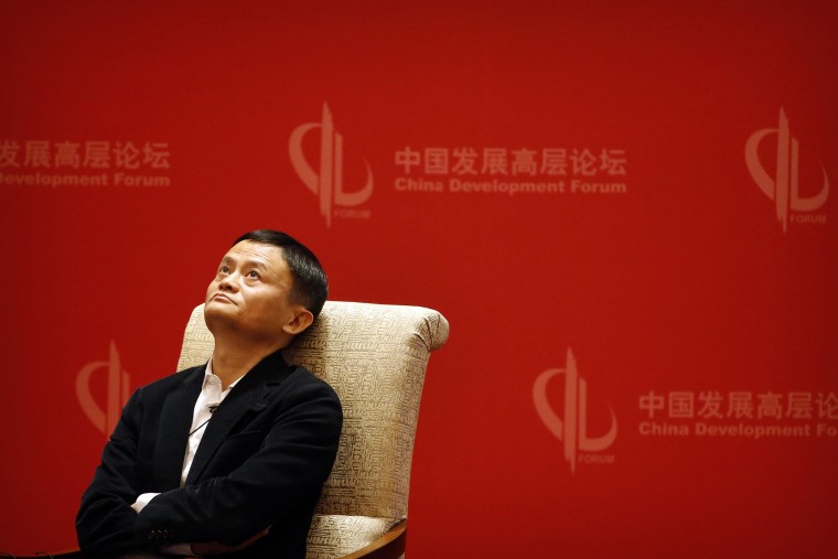 Image: Jack Ma, executive chairman of the Alibaba Group, looks up during a panel discussion held as part of the China Development Forum at the Diaoyutai State Guesthouse in Beijing.