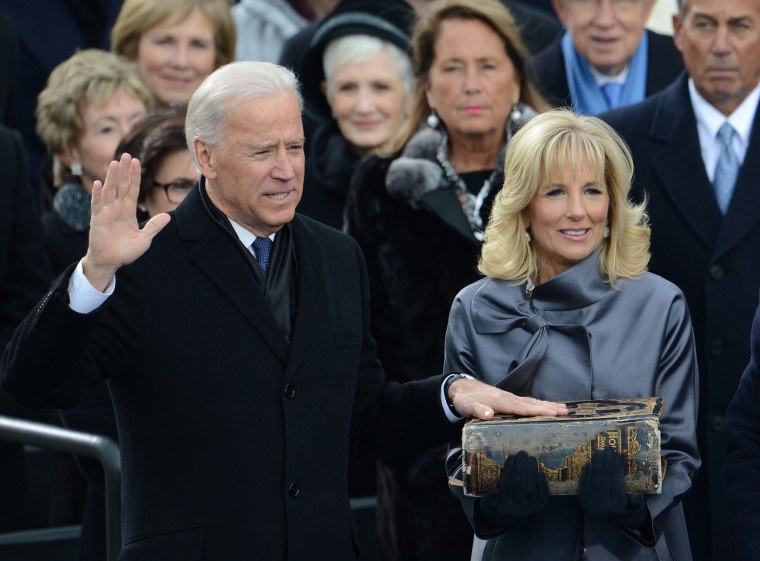 Image: Vice President Joe Biden is sworn-in as his wife Jill holds the Bible during the 57th Presidential Inauguration ceremonial swearing-in at the U.S. Capitol