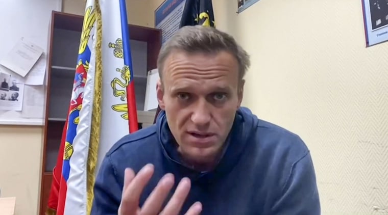 Image: Russian opposition leader Alexei Navalny speaking while waiting for a court hearing at a police station in Khimki outside Moscow.