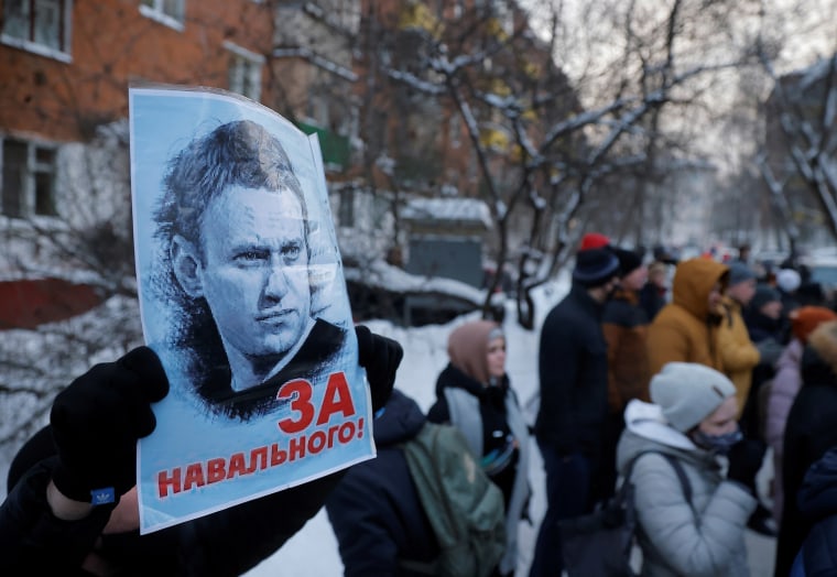 Image: People, including supporters of Alexei Navalny, gather outside a police station where the opposition leader is being held following his detention, in Khimki?EUR(R)