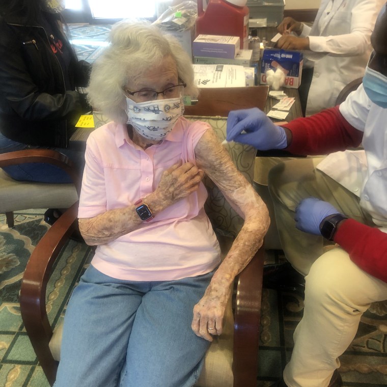 Ruth Anderson, who was born in 1918, gets her second dose of the Pfizer COVID-19 vaccine in Naples, Florida, on Jan. 19.