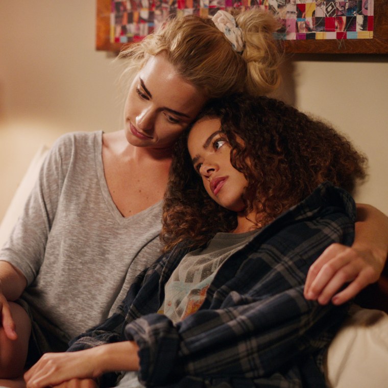 Georgia (Brianne Howey) holds her 15-year-old daughter Ginny (Antonia Gentry) in a scene from the new Netflix series "Ginny &amp; Georgia. 