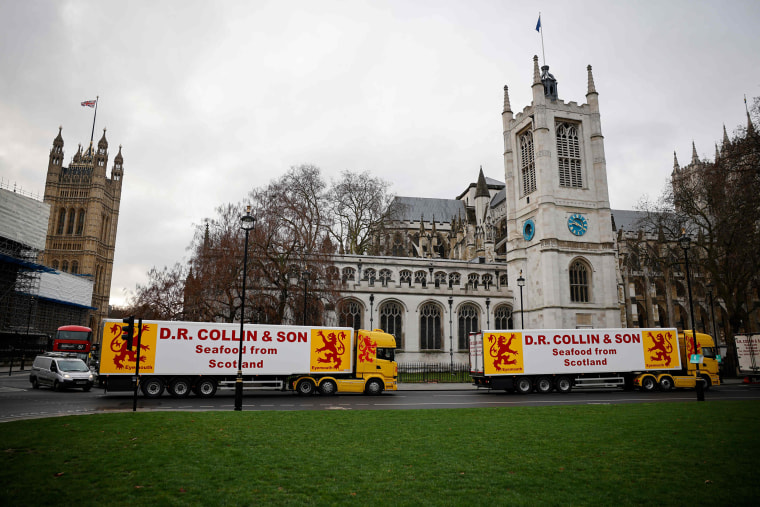Image: Lorries from Scottish seafood companies drive past the Houses of Parliament in a protest action by fishermen against post-Brexit red tape and coronavirus restrictions, which they say could threaten the future of the industry, in London