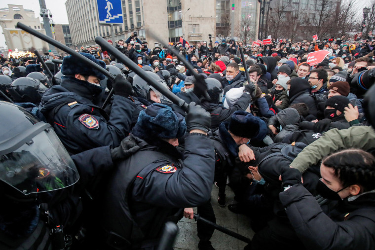 Image: Law enforcement officers clash with participants during a rally in support of jailed Russian opposition leader Alexei Navalny in Moscow