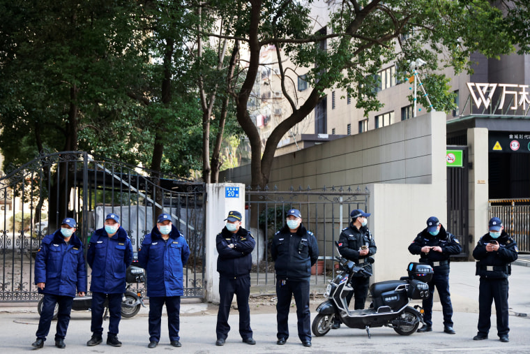 Image: WHO team members at a hospital in Wuhan