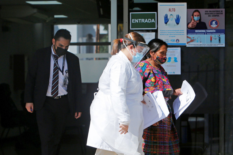 Image: Member of Guatemalan Maya families, who feared their relatives were among 19 bodies found shot and burnt at the weekend in a remote part of northern Mexico, arrive to the Faculty of Medicine for DNA samples to help in the identification, in Guatema