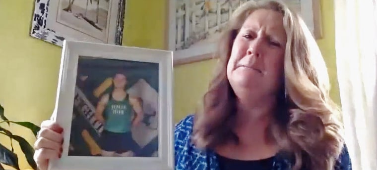 Lisa Moore holds a photo of her son, Trevor Till.