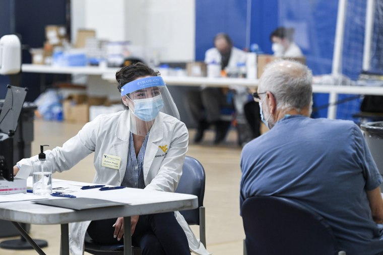 Image: WVU pharmacy student Ashton Prusia and Richard Thomas on Jan. 27, 2021.