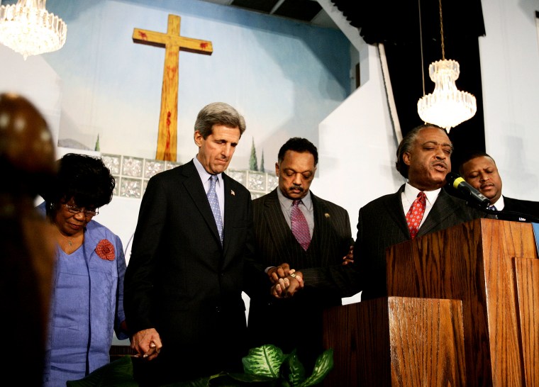 Image: Sen. John Kerry holds hands with retired Rep. Carrie Meek, Rev. Jesse Jackson and Rev. Al Sharpton at the Friendship Missionary Baptist Church in Miami in 2004.