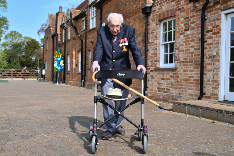 Image: British World War II veteran Captain Tom Moore, 99, poses with his walking frame in the village of Marston Moretaine on Thursday. 