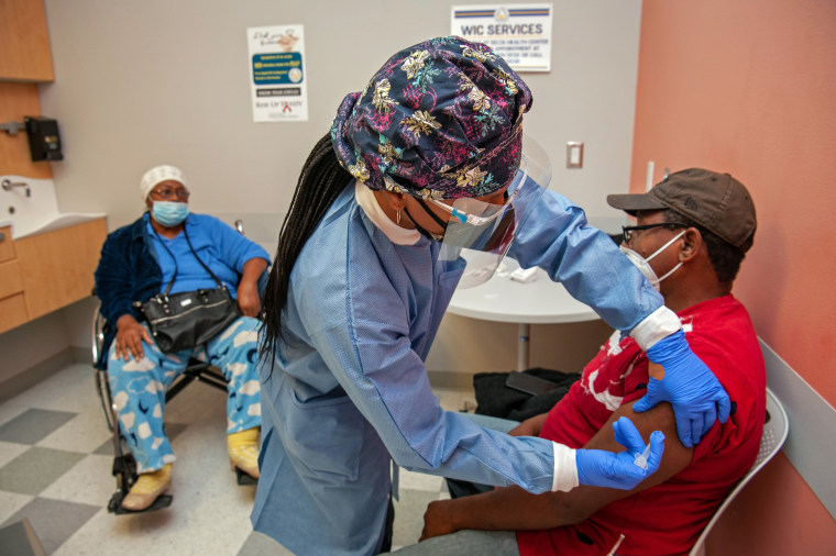 Image: Tara Gallion administers the Moderna Covid-19 vaccine to Eddie Williams at the Delta Health Center in Mound Bayou, Miss,. 30, 2021. (Rory Doyle/The New York Times)