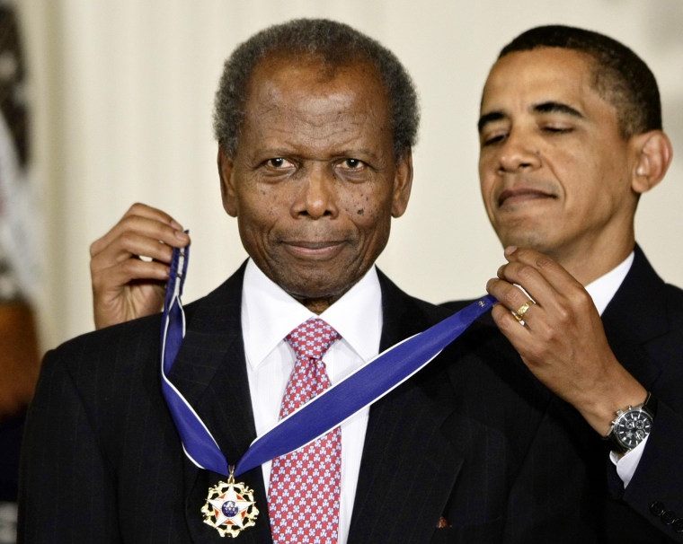 Image: President Barack Obama presents the 2009 Presidential Medal of Freedom to Sidney Poitier during ceremonies in the East Room of the White House on Aug. 12, 2009.