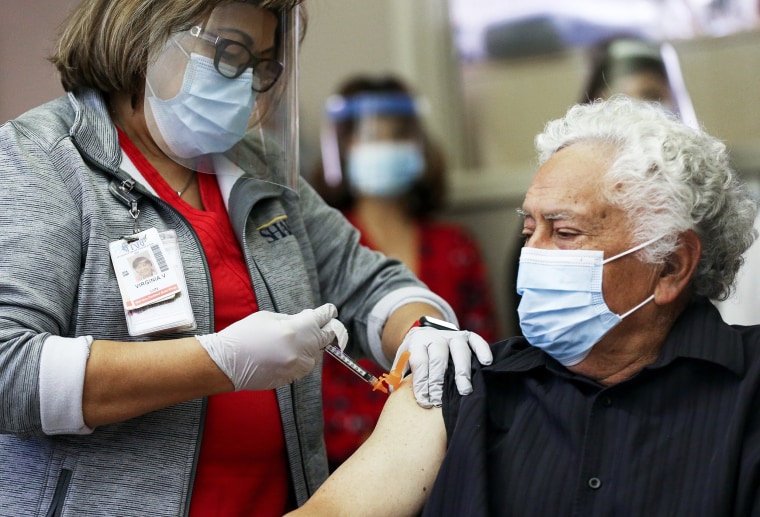 Image: Southern California hospital administers Pfizer Covid-19 vaccine to long-term care patient