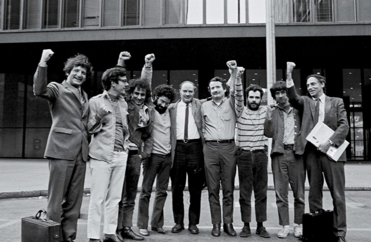 Image: Portrait of the Chicago Seven and their lawyers as they raise their fists in unison outside the courthouse where they were on trial for conspiracy and inciting a riot during the 1968 Democratic National Convention,