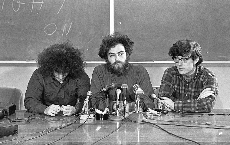 Image: Three of the Chicago Seven, seated from left, American political activists and antiwar demonstrators Abbie Hoffman, Jerry Rubin, and Rennie Davis hold a press conference during their trial for conspiracy to incite violence at the 1968 Democratic Na