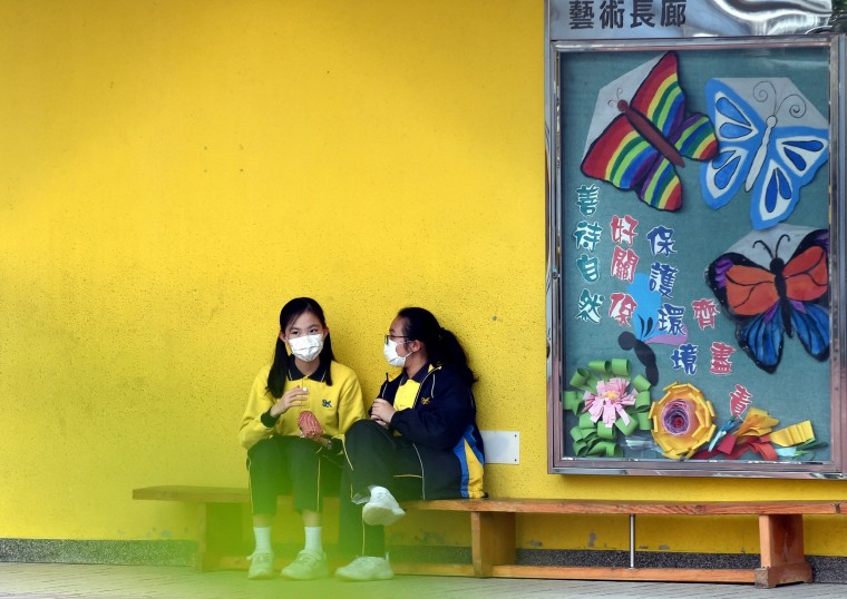 Image: Students talk at a school in south China's Hong Kong, Jan. 27, 2021.