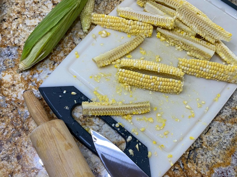 To make corn ribs, corn on the cob gets chopped into four equal parts and marinated before cooking.