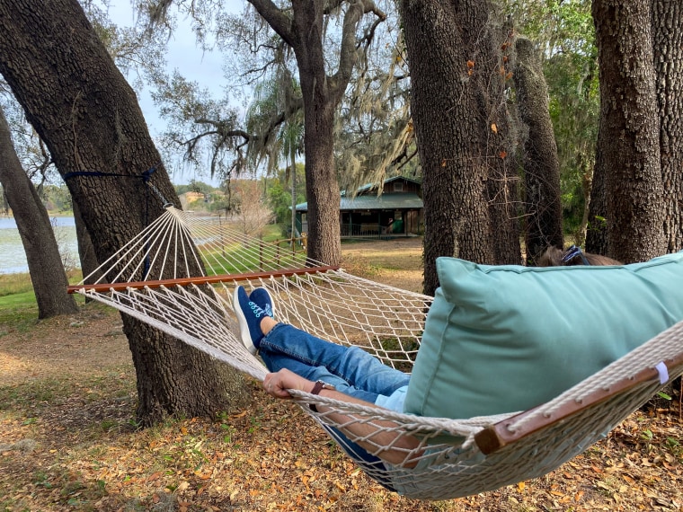 Guests of Munchie's Live BBQ can relax lakeside on hammocks until chef Mann rings the dinner bell.