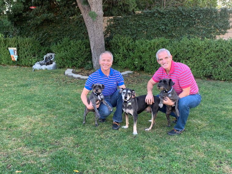 Bernie Knobbe and Tim Belavich with their dogs, Pawpaw, Ella and Henry.