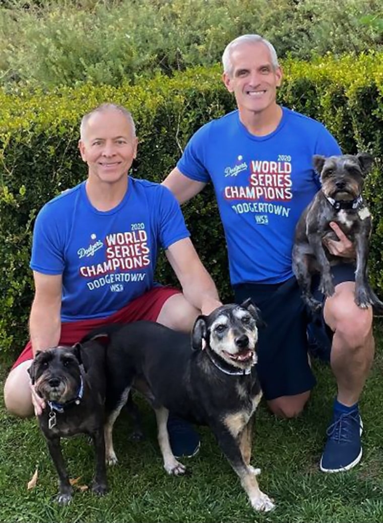 Bernie Knobbe and Tim Belavich with their dogs, Pawpaw, Ella and Henry.