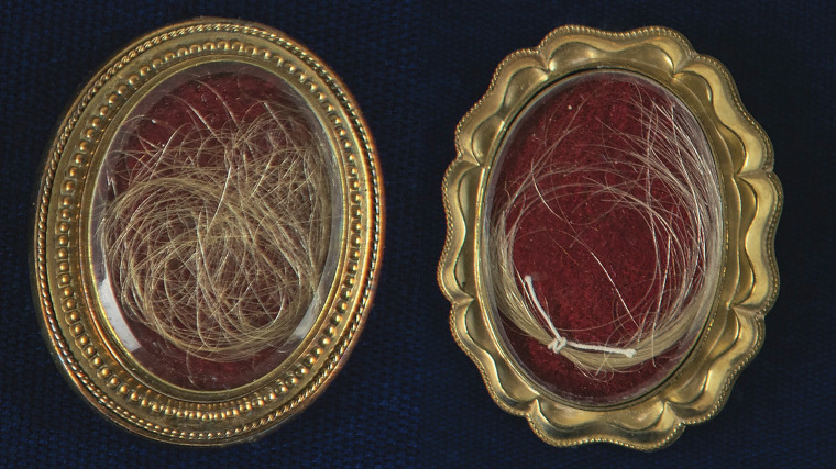 Locks of hair from the heads of the first United States President George Washington, right, and from his wife Martha, left, up for auction between Feb. 11-18, 2021.