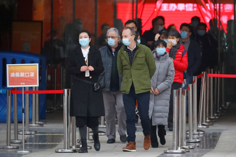 Image: Members of the World Health Organisation (WHO) tasked with investigating the origins of the coronavirus disease (COVID-19) pandemic, leave an exhibition on how China fought the coronavirus in Wuhan, Hubei province, Chin