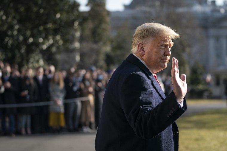 Image: President Donald Trump waves as he walks to Marine One on the South Lawn of the White House before boarding Marine One.