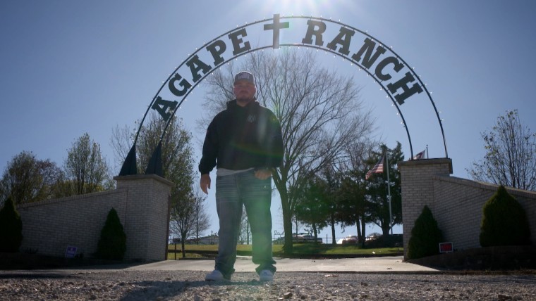 Image: Colton Schrag outside the Agape Boarding School in Missouri.