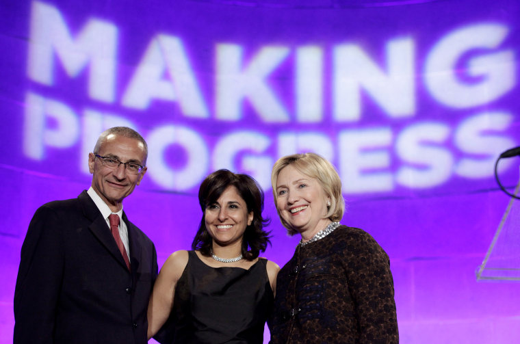 Former Secretary of State Clinton poses with President of CAP Neera Tanden and CAP Chairman John Podesta at the 10th Anniversary policy forum in Washington