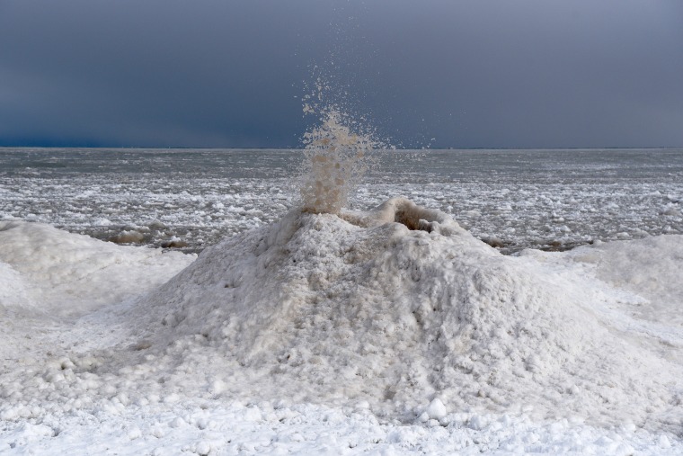 Image: An ice volcano erupts along Lake Michigan