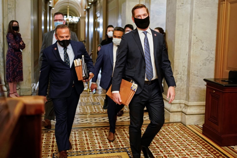 Image: House Impeachment Managers David Cicilline and Eric Swalwell depart Capitol Hill