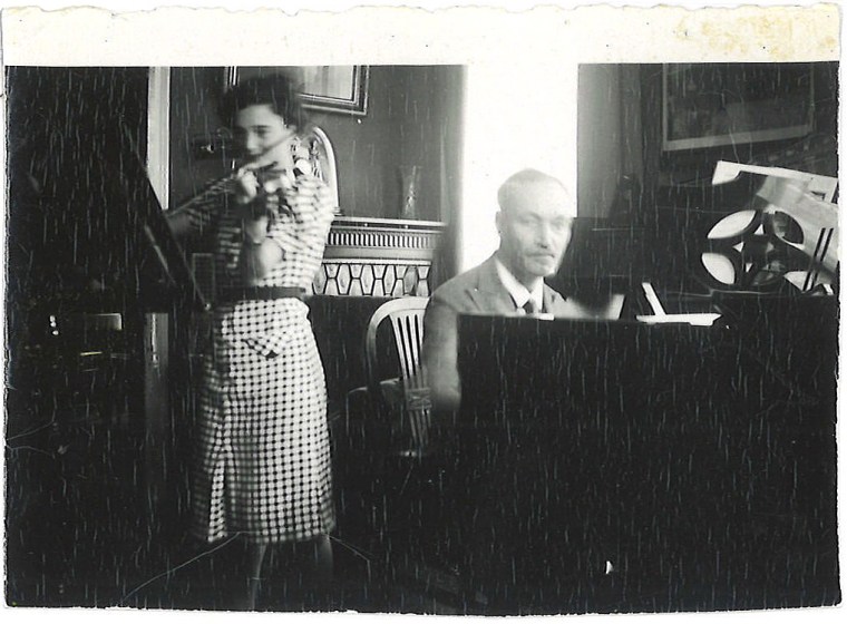 Felix Hildesheimer plays piano accompaniment as his youngest daughter plays the violin in 1930s Speyer, Germany