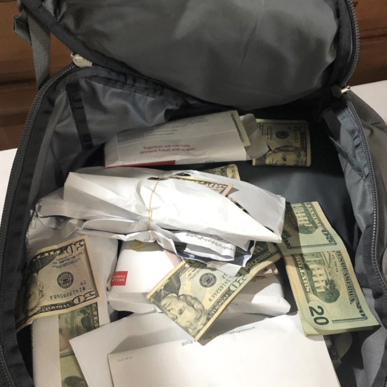 Image: At Nyugen Social Services, investigators uncovered in cash stuffed in a backpack.